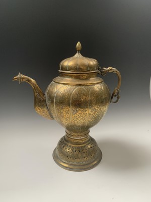 Lot 358 - An Indian brass hot water jug, 18th/19th...