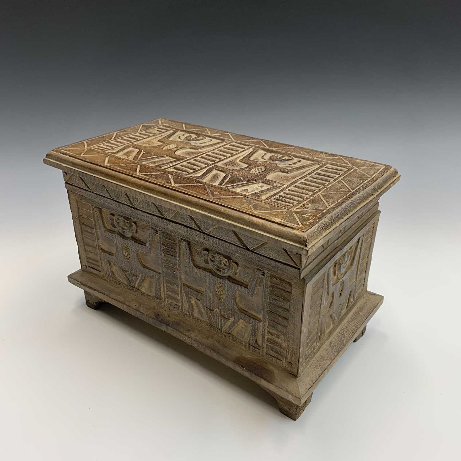 Lot 45 - An African carved wood box with figural and large carved wooden box