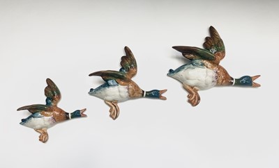 Lot 937 - A set of three graduated Beswick flying duck...