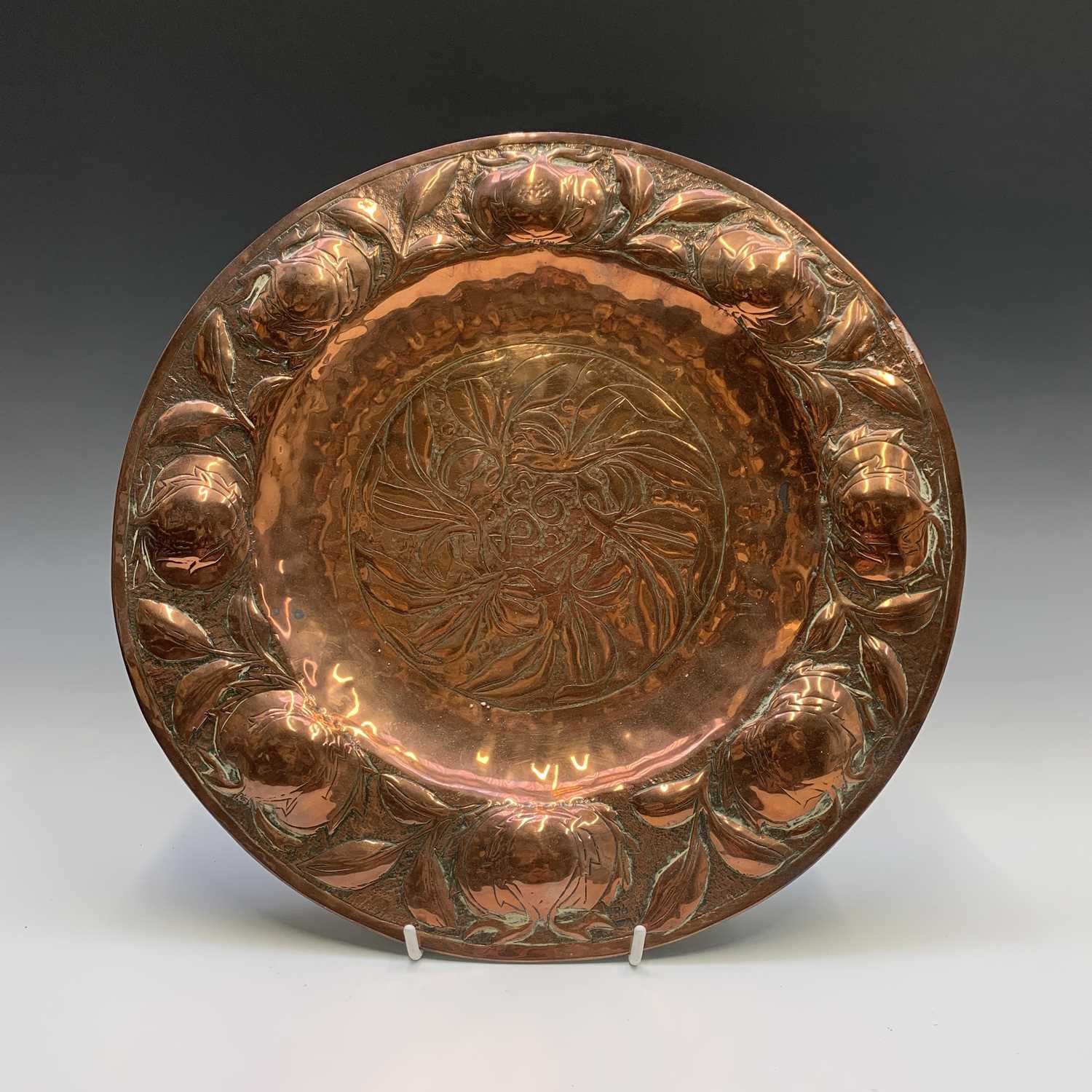 Lot 58 - An Arts and Crafts period copper charger, the...