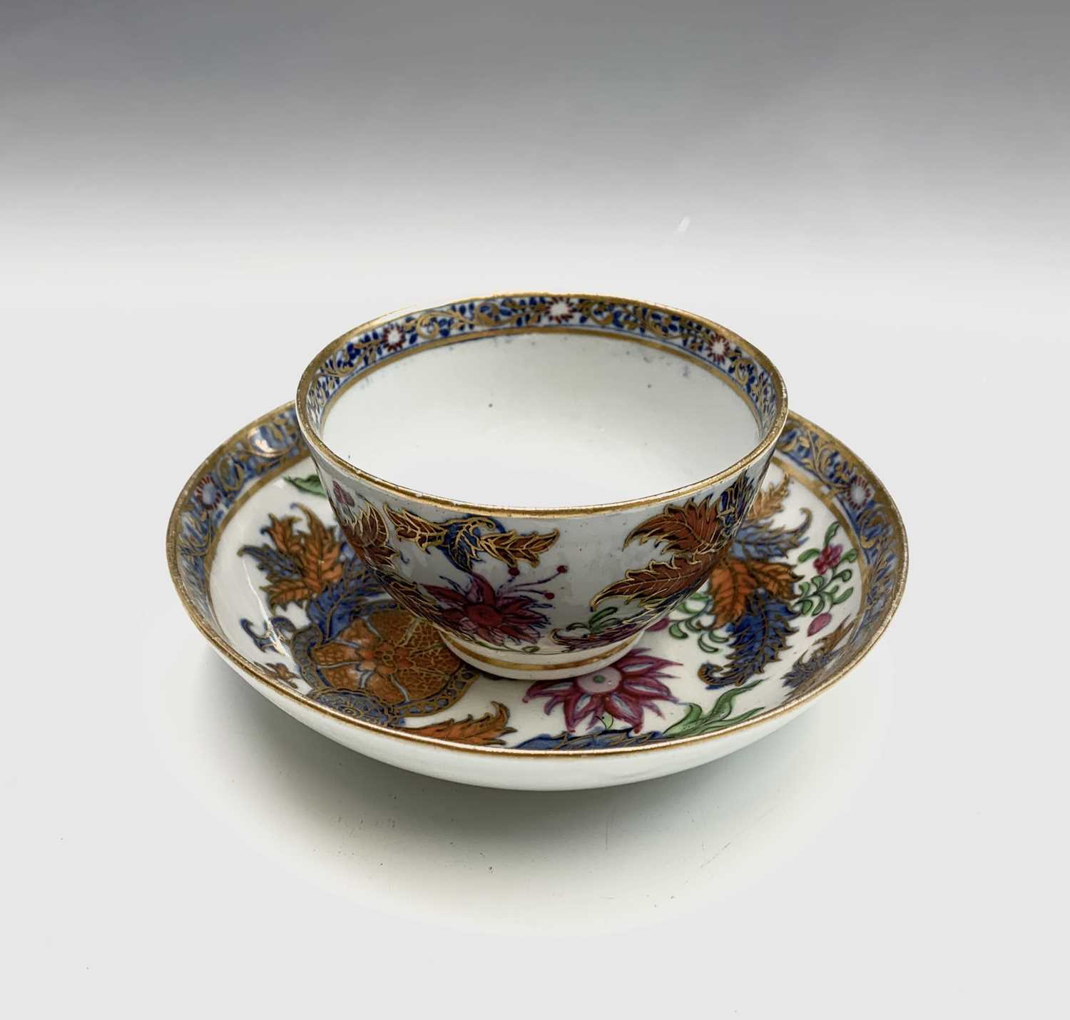 Lot 883 - A Newhall porcelain tea bowl and saucer, circa...