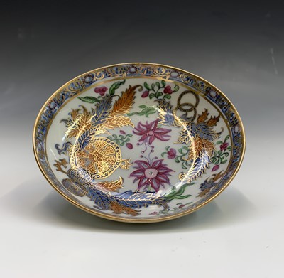 Lot 883 - A Newhall porcelain tea bowl and saucer, circa...