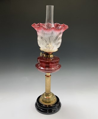 Lot 81 - A Victorian brass oil lamp, with cranberry...