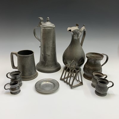 Lot 302 - A 19th century pewter flagon with hinged cover,...