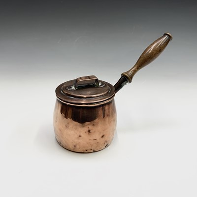 Lot 70 - A 19th century copper chocolate pot and hinged...