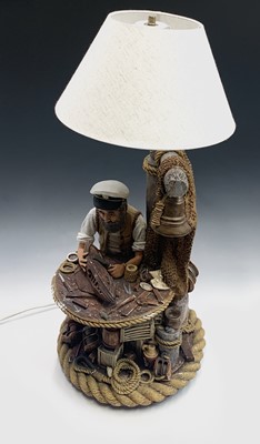 Lot 75 - A plaster figural table lamp, modelled as a...