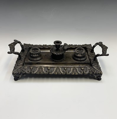 Lot 85 - A Regency bronze Standish, the central taper...