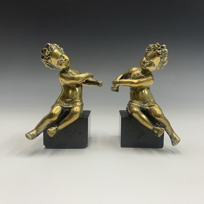 Lot 86 - A pair of 19th century gilt brass cherub...