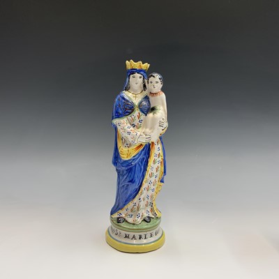 Lot 896 - A French tinglazed figure, late 19th century,...