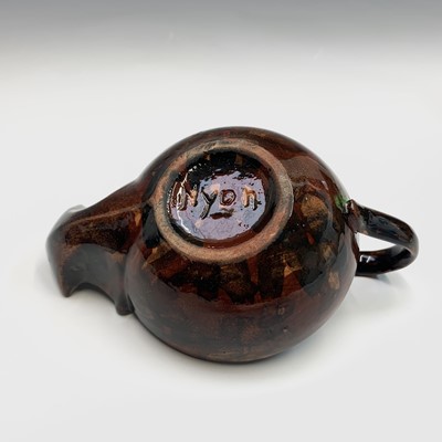Lot 906 - A 19th century agateware pottery inkstand,...