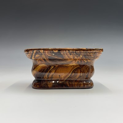 Lot 906 - A 19th century agateware pottery inkstand,...