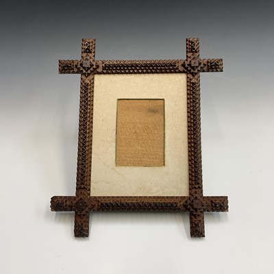 Lot 103 - A Tramp art picture frame, circa 1900, with...