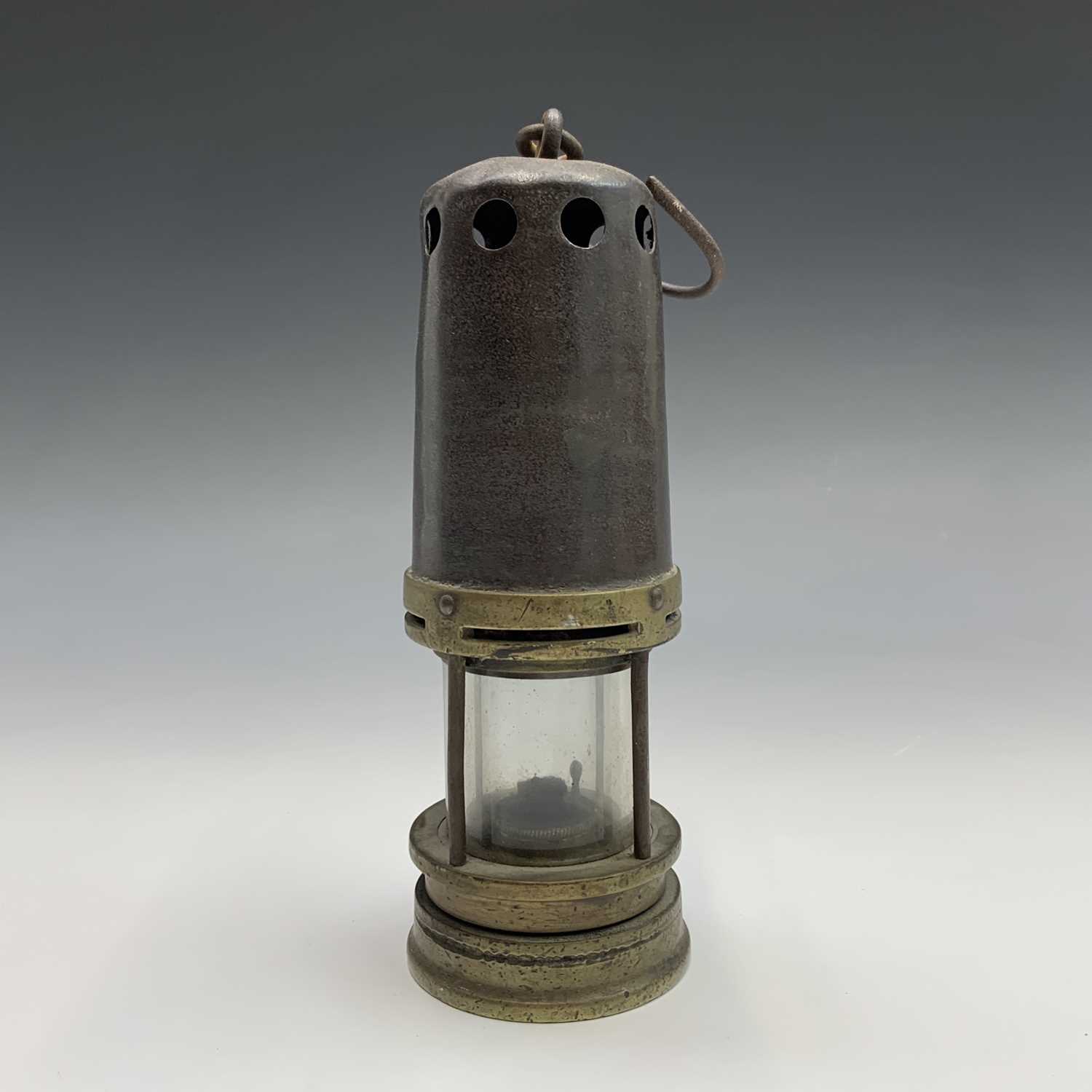 Lot 91 - A Brass and steel miner's lamp, early 20th...