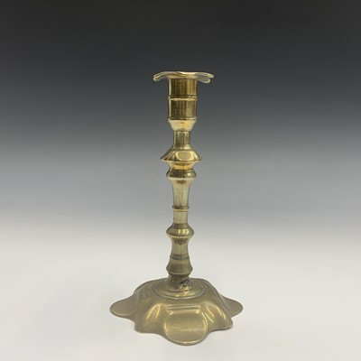 Lot 116 - An 18th century brass candlestick, with...