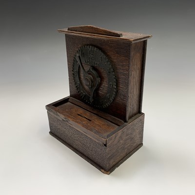 Lot 119 - An unusual oak money box, circa 1920, with...