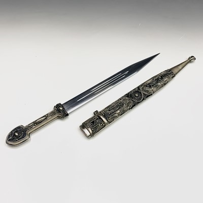 Lot 113 - An Eastern white metal dagger, with filigree...