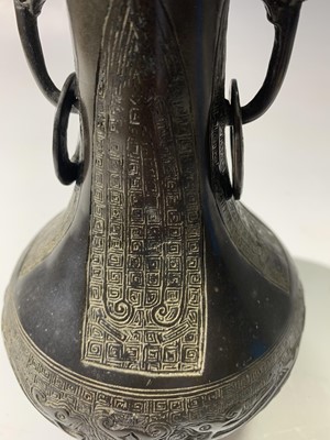 Lot 320 - A Chinese bronze bottle vase, probably Ming,...