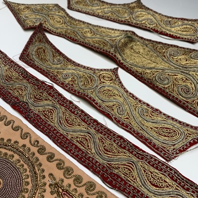 Lot 399 - Nine Indian metal thread embroidered panels,...