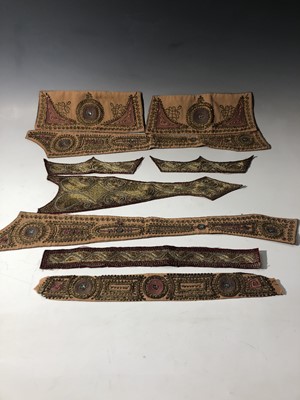 Lot 399 - Nine Indian metal thread embroidered panels,...