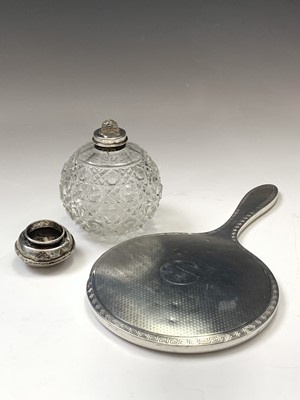Lot 48 - An engine-turned silver-mounted hand mirror, a...