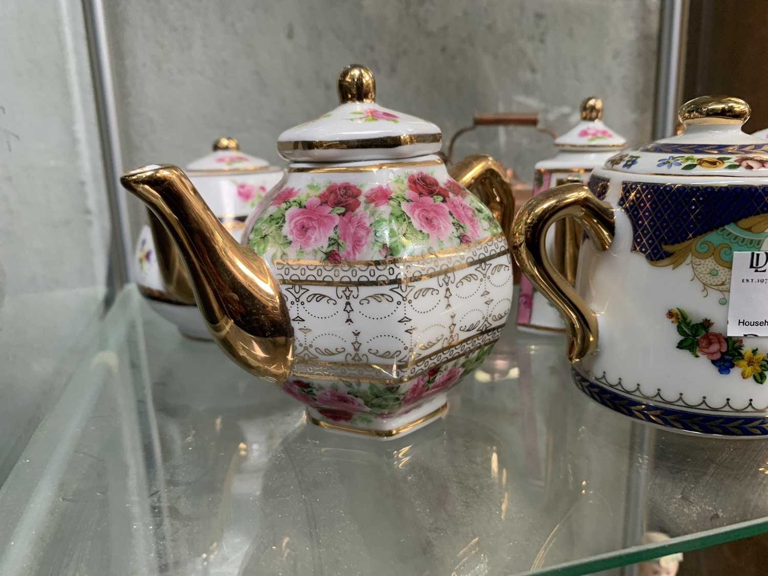 Lot 62 Miniature porcelain teapots etc