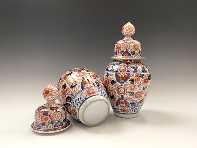 Lot 97 - A pair of Japanese imari vases and covers,...