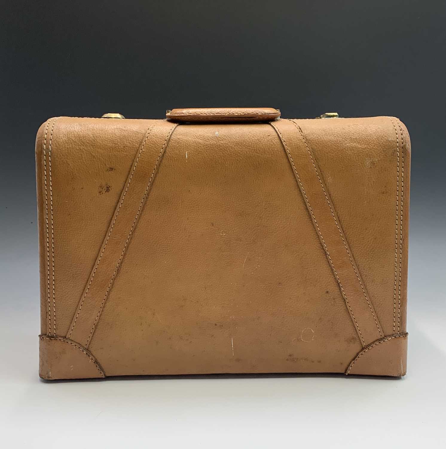 Lot 2809 - A 1950s Platt Luggage leather suitcase. Height...