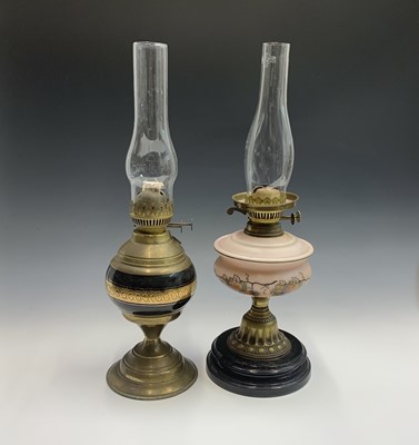 Lot 196 - An early 20th century oil lamp, and one other,...