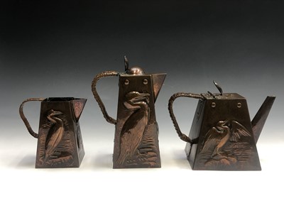 Lot 190 - A Newlyn copper three piece tea set comprising...