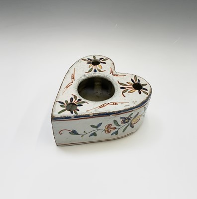 Lot 981 - A Delft heart shaped inkwell and pen holder...