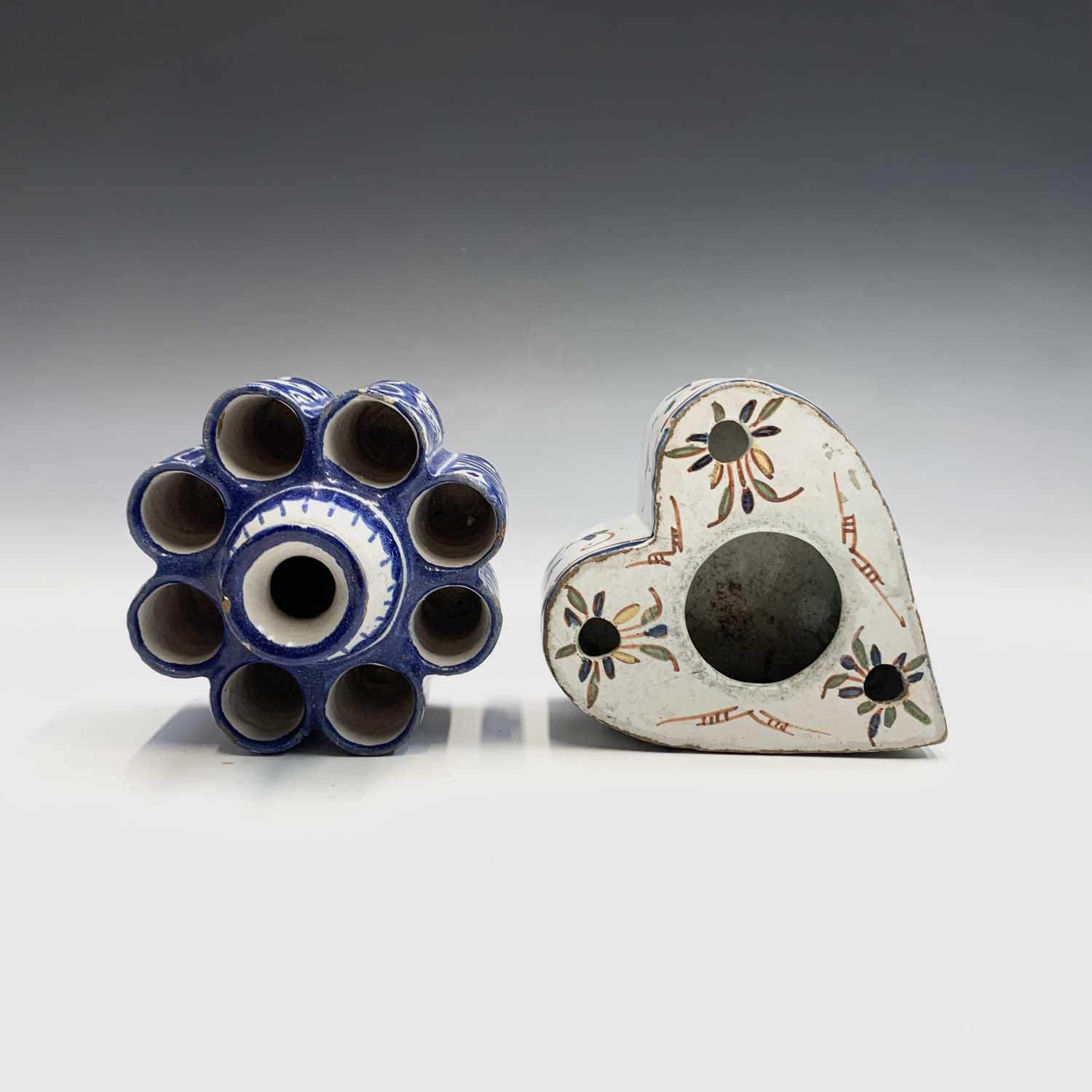 Lot 981 - A Delft heart shaped inkwell and pen holder...