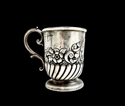 Lot 1 - An Edwardian silver christening mug, half...