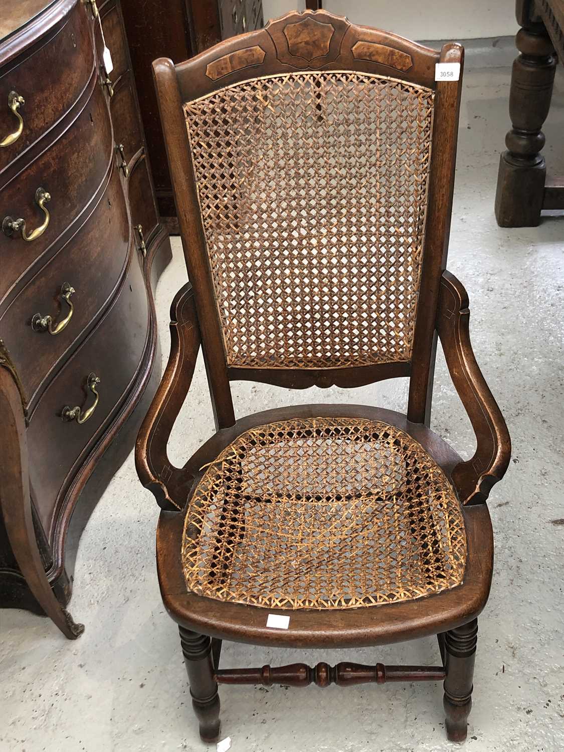 Lot 3058 - An Edwardian walnut armchair, with cane back...