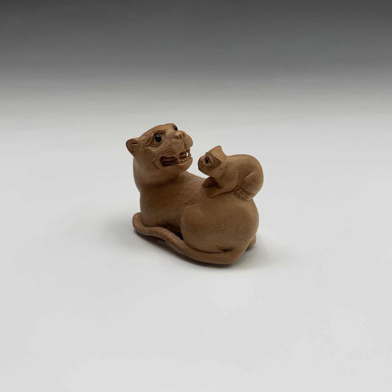 Lot 277 - A Japanese carved wood netsuke, signed, width...