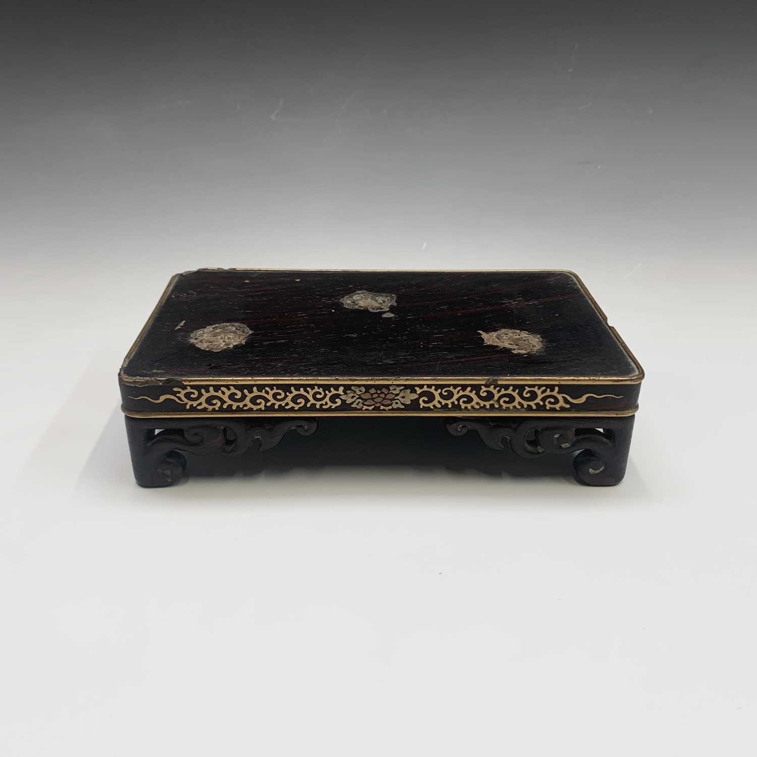 Lot 273 - A Chinese wood and gilt metal inlaid stand,...