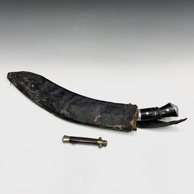 Lot 180 - A kukri, with horn and cast metal grip, in a...