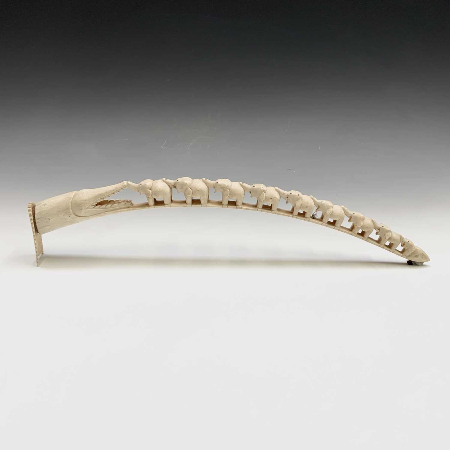 Lot 290 - A carved ivory tusk, early 20th century, with...