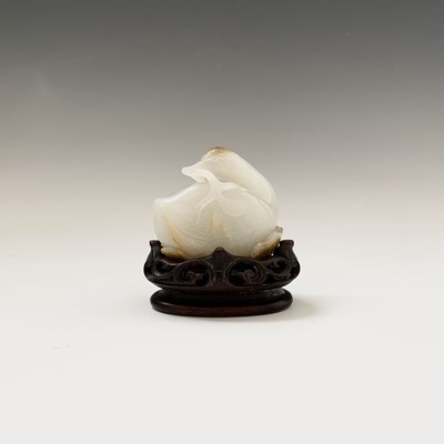 Lot 15 - A fine Chinese white jade carving of a duck,...