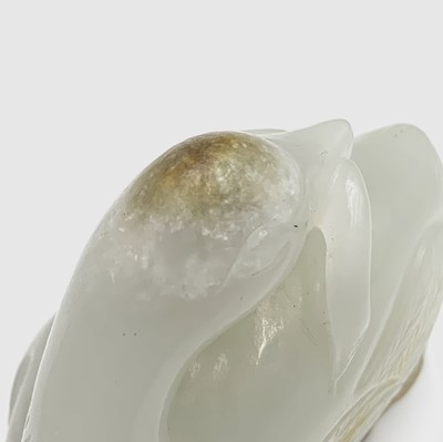 Lot 15 - A fine Chinese white jade carving of a duck,...