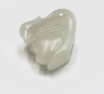 Lot 16 - A small Chinese white jade carving of a duck,...