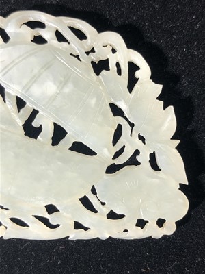 Lot 18 - A Chinese carved & pierced white jade plaque,...