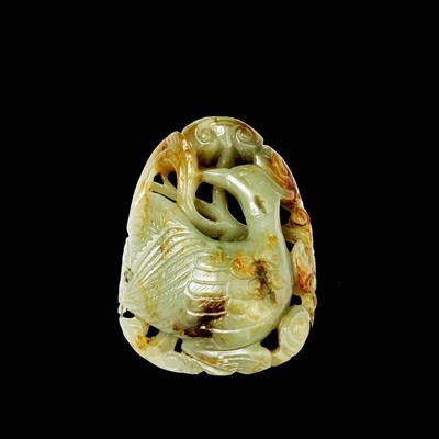 Lot 33 - A Chinese carved & reticulated celadon jade...