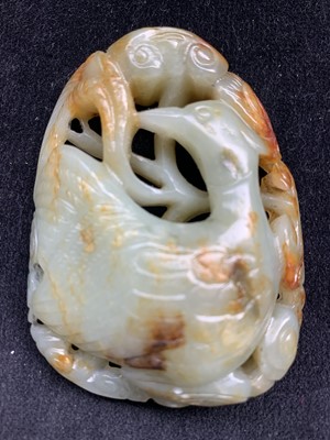 Lot 33 - A Chinese carved & reticulated celadon jade...