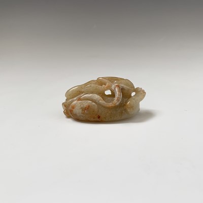 Lot 21 - A Chinese carved jade figure of a feline, with...