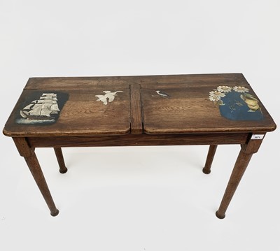 Lot 1809 - An Arts and Crafts oak double school desk, the...