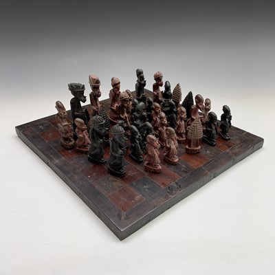 Lot 273 - An African hardwood chess set, the pieces...