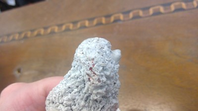 Lot 970 - A biscuit porcelain poodle, circa 1820,...