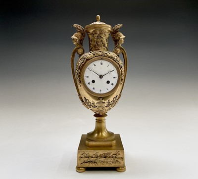 Lot 2918 - A French Empire ormolu cased mantel clock, of...