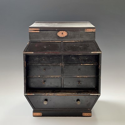 Lot 80 - A Japanese black lacquered table cabinet, the...