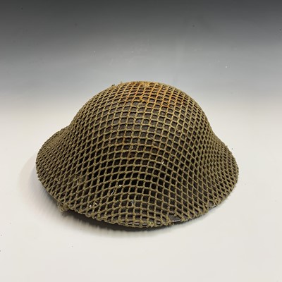 Lot 244 - British Army Second World War helmet.